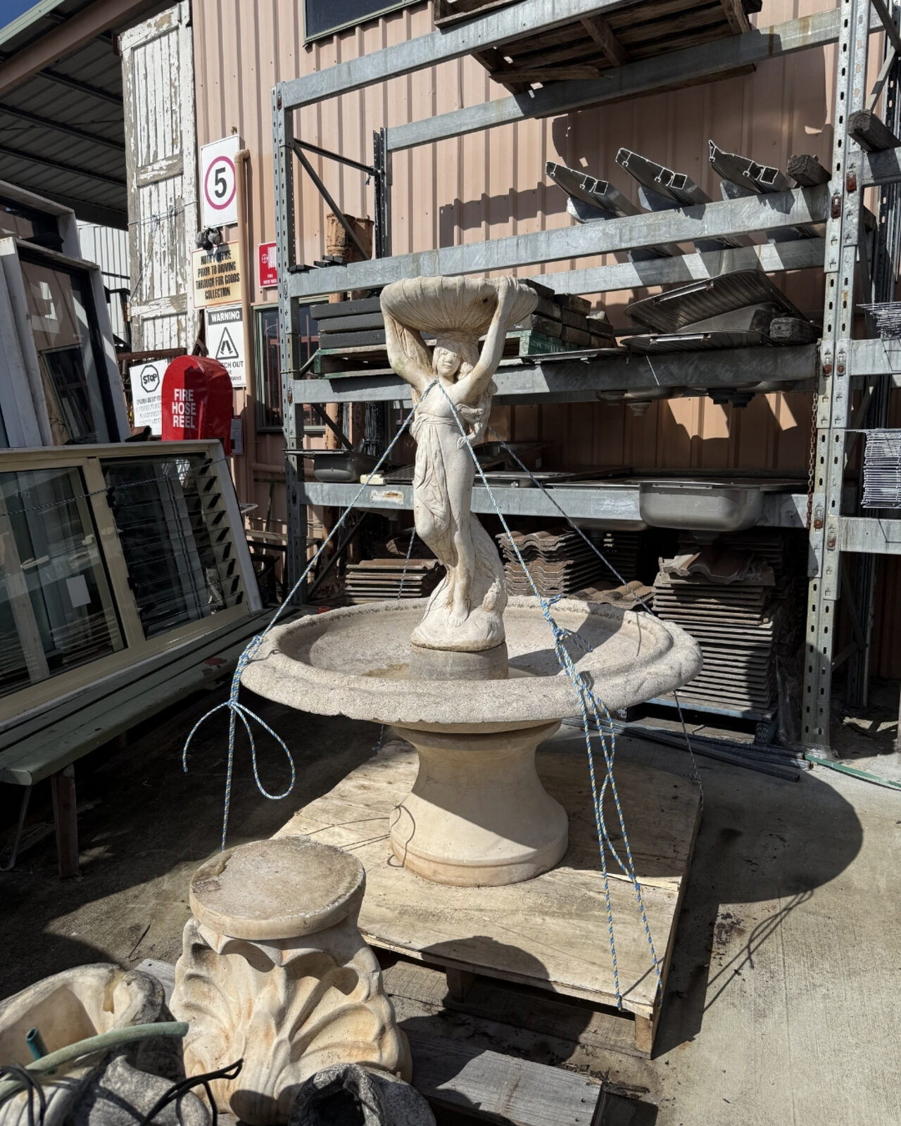 Antique stone fountain in the yard